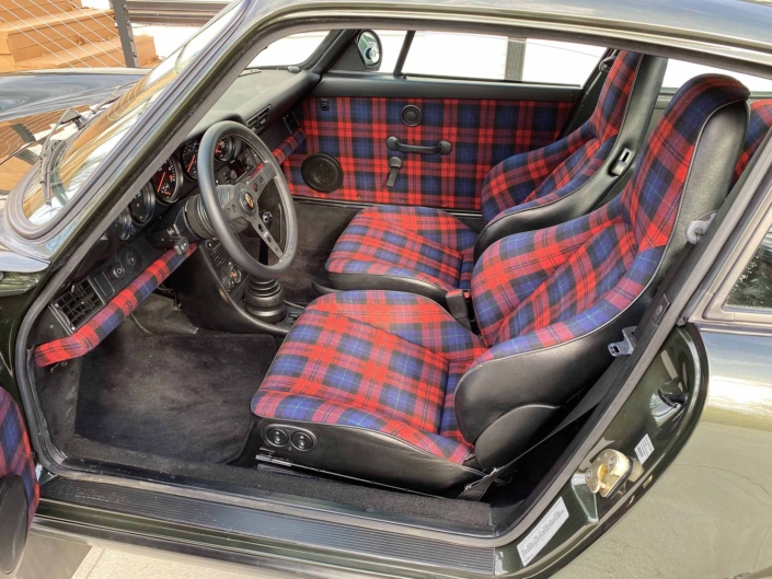 interior shot of a Custom Built 1986 Porsche 930 Turbo with Oak Green Metallic Exterior and Porsche tartan interior