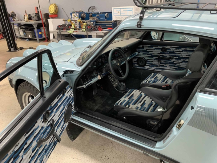 Custom Built 1988 Porsche 930 Turbo with Meissen Blue exterior and Carrera fabric interior with the door open showcasing the interior