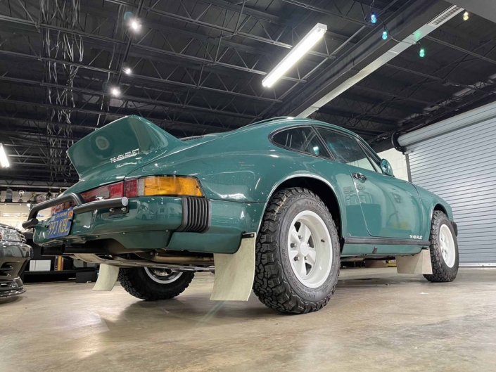 rear view of a Custom Built 1974 Porsche 911 in Smyrna Green with Fiat fabric