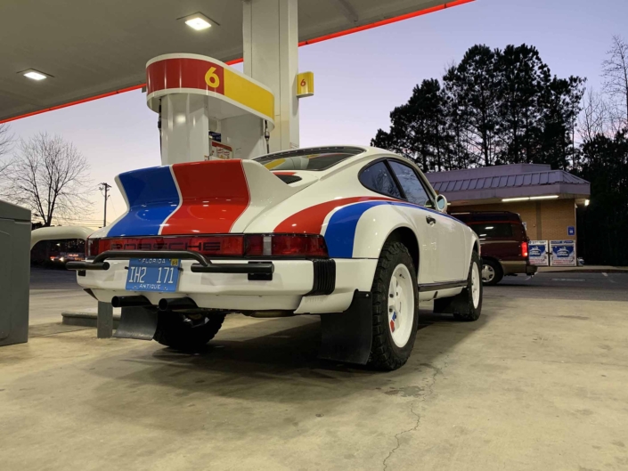 Custom Built 1982 Porsche 911 SC with Brumos Livery Exterior and Porsche Tartan Interior parked at a gas station
