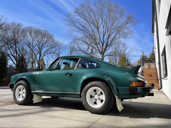 side view of a Custom Built 1974 Porsche 911 in Smyrna Green with Fiat fabric