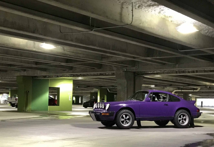 Custom Built 1978 Porsche 911 SC with Lilac exterior and Pascha interior parked in a parking garage