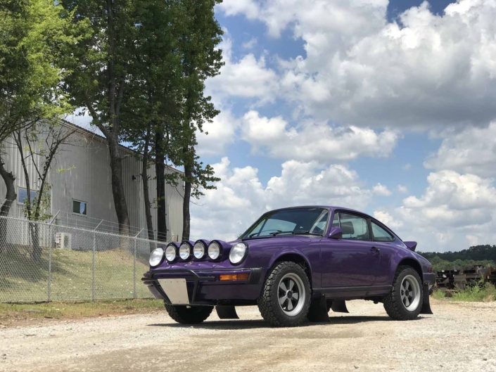 Custom Built 1978 Porsche 911 SC with Lilac exterior and Pascha interior parked on a dirt driveway