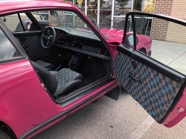 Custom Built 1988 Porsche 911 Carrera with Ruby Stone Exterior and Mercedes Fabric Interior with the door open