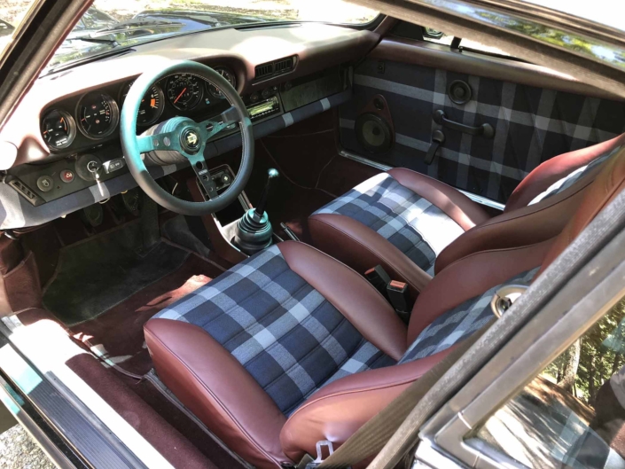 front seating of Leh Keen's Custom Built 1986 Porsche 911 Carrera with Shwartz Exterior and Mercedes G Fabric Interior