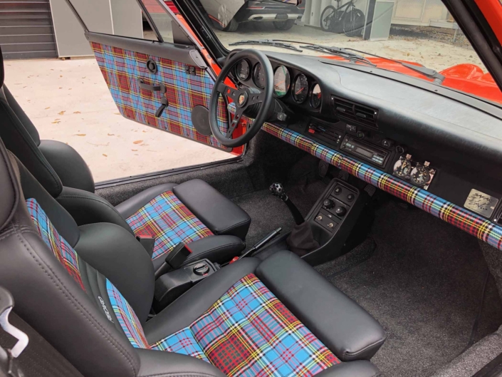 VW tartan interior on a Custom built 1987 Porsche 911 Carrera with Continental Orange exterior