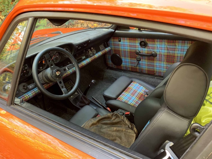 VW tartan interior on a Custom built 1987 Porsche 911 Carrera with Continental Orange exterior