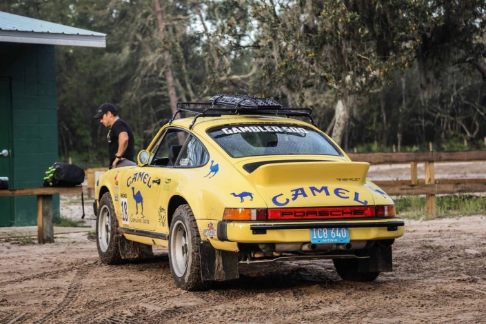 rear view of a Custom Built 1984 Porsche 911 Carrera Euro with Hellgelb Exterior and Mercedes Tartan Interior