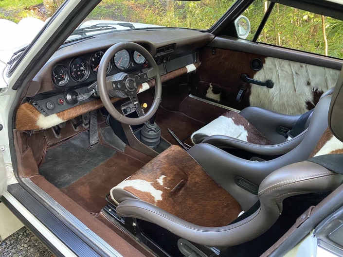 dash view of a Custom Built 1981 Porsche 911 SC with Grand Prix White exterior and Cow Interior