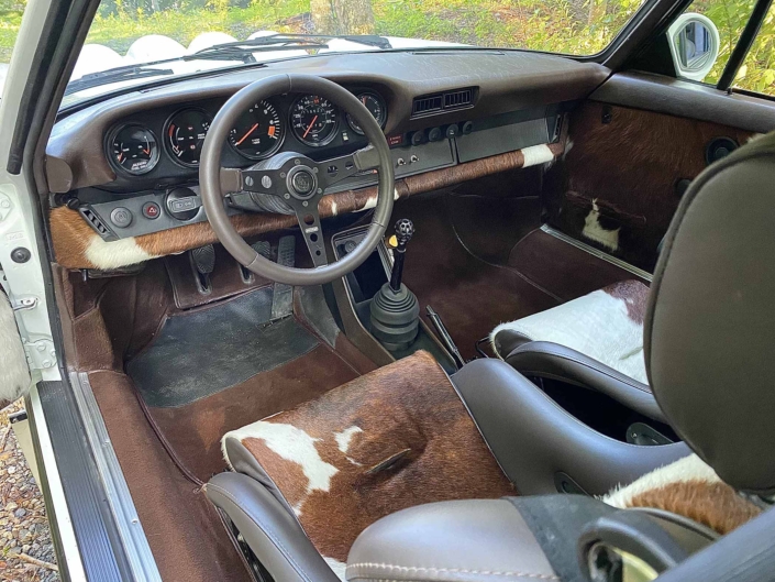 dash view of a Custom Built 1981 Porsche 911 SC with Grand Prix White exterior and Cow Interior