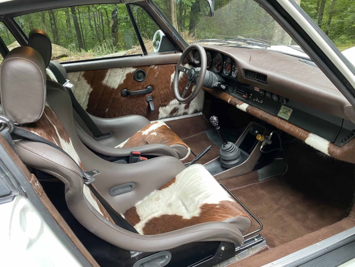 front interior view of a Custom Built 1981 Porsche 911 SC with Grand Prix White exterior and Cow Interior