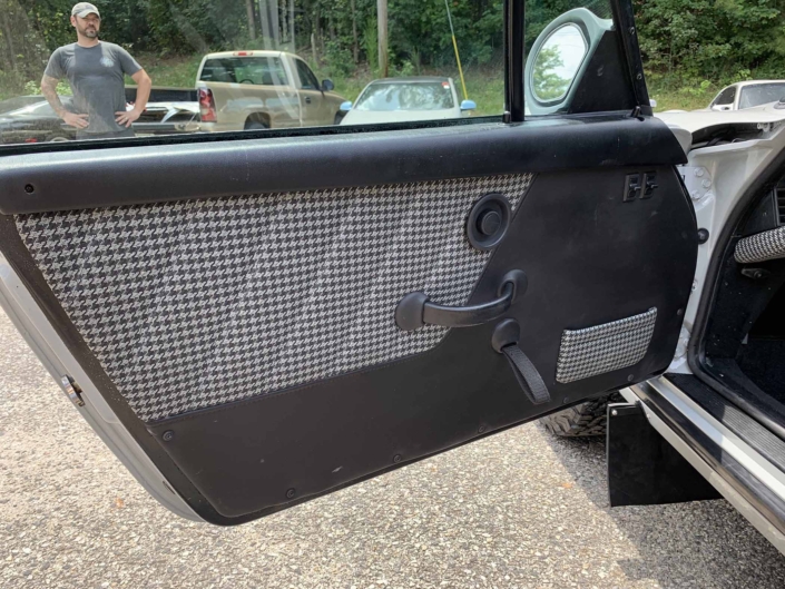 door handle of a rear view of a custom 1986 Porsche 911 Carrera