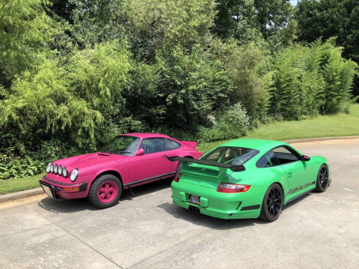 Custom Built 1988 Porsche 911 Carrera with Ruby Stone Exterior and Mercedes Fabric Interior parked on a sunny day