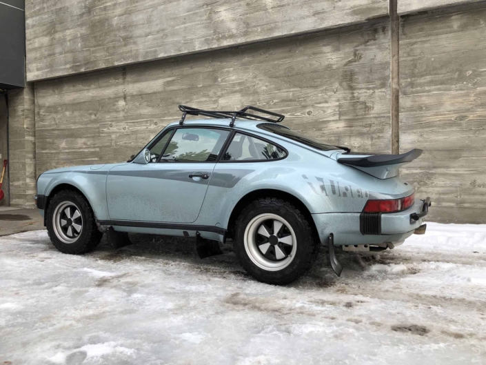 Custom Built 1988 Porsche 930 Turbo with Meissen Blue exterior and Carrera fabric interior parked in the snow