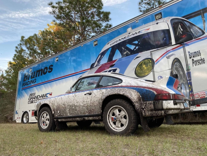 Custom Built 1982 Porsche 911 SC with Brumos Livery Exterior and Porsche Tartan Interior parked in front of a mural