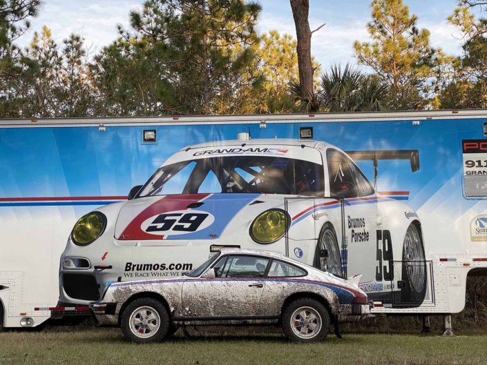 Custom Built 1982 Porsche 911 SC with Brumos Livery Exterior and Porsche Tartan Interior parked in front of a mural