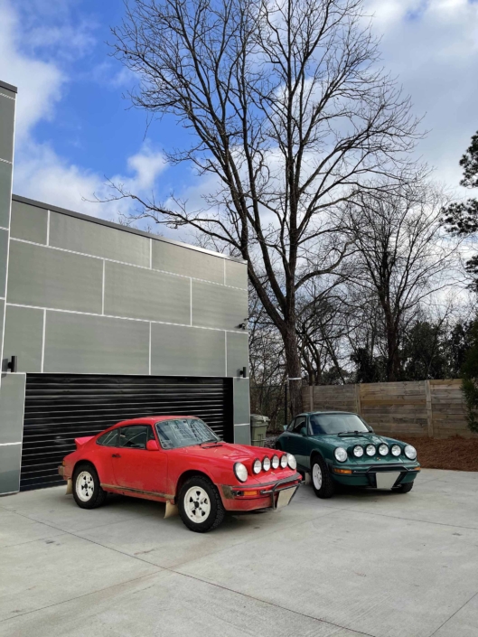 Custom Built 1974 Porsche 911 in Smyrna Green with Fiat fabric parked outside