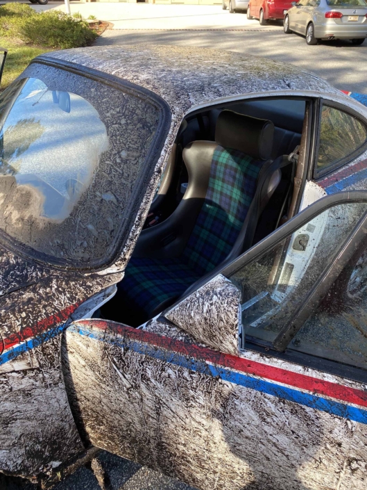 Custom Built 1982 Porsche 911 SC with Brumos Livery Exterior and Porsche Tartan Interior with the door open after going off roading