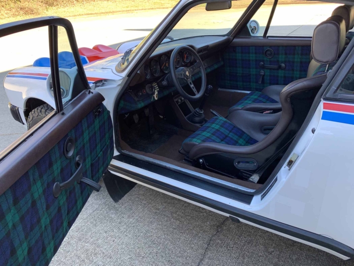 Custom Built 1982 Porsche 911 SC with Brumos Livery Exterior and Porsche Tartan Interior with the door open showcasing the custom interior