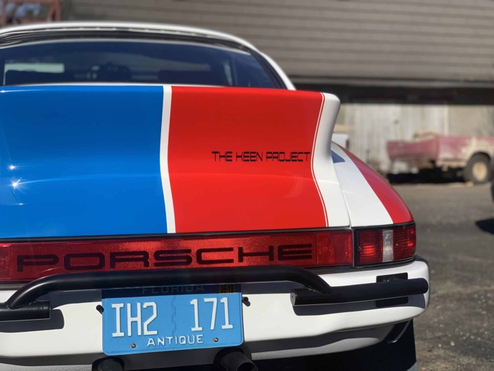 rear view of a Custom Built 1982 Porsche 911 SC with Brumos Livery Exterior and Porsche Tartan Interior