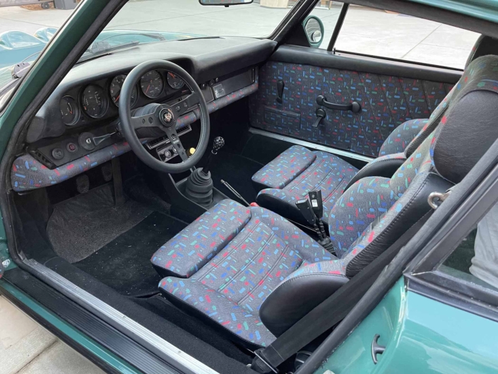 custom front seating on a 1974 Porsche 911 in Smyrna Green with Fiat fabric
