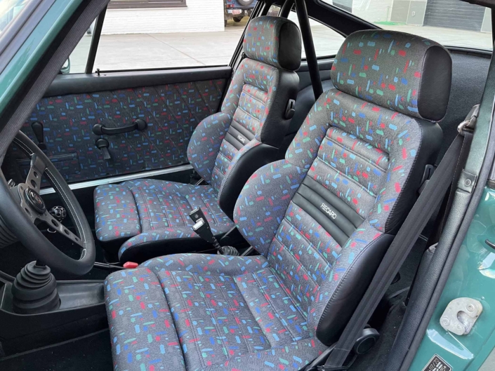 custom front seating on a 1974 Porsche 911 in Smyrna Green with Fiat fabric