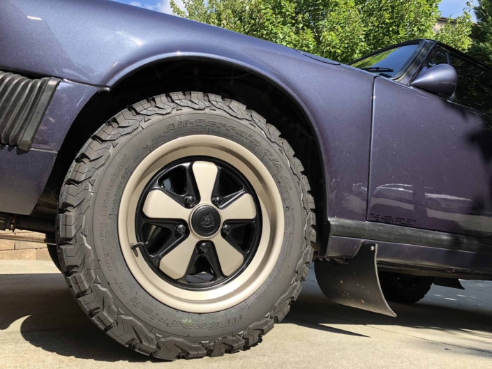 tire shot of Custom Built 1986 Porsche 911 Carrera Euro with Prussian Blue Exterior and Porsche Studio Check Interior