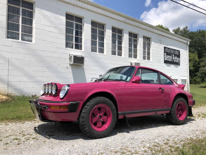 3/4 side view of a Custom Built 1988 Porsche 911 Carrera with Ruby Stone Exterior and Mercedes Fabric Interior