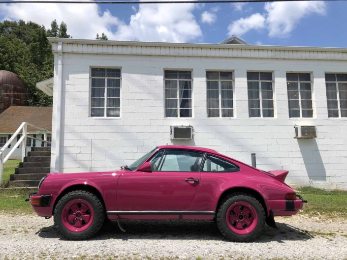 side view of Leh Keen's Custom Built 1988 Porsche 911 Carrera with Ruby Stone Exterior and Mercedes Fabric Interior