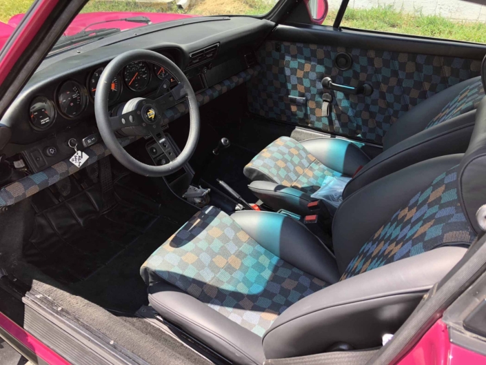 interior shot of a Custom Built 1988 Porsche 911 Carrera with Ruby Stone Exterior and Mercedes Fabric Interior