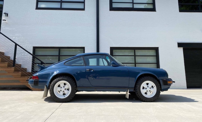 side view of a Custom Built 1987 Porsche 911 Carrera with Aga Blue exterior and Carrera fabric interior