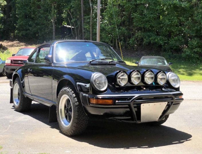 3/4 frontal view of Leh Keen's Custom Built 1986 Porsche 911 Carrera with Shwartz Exterior and Mercedes G Fabric Interior