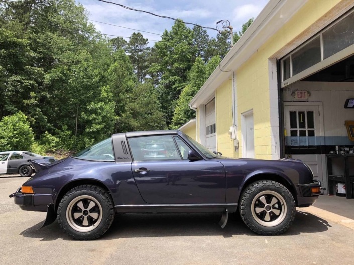 side view of Custom Built 1986 Porsche 911 Carrera Euro with Prussian Blue Exterior and Porsche Studio Check Interior