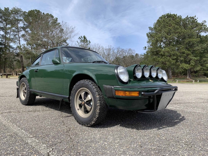 3/4 frontal view of a Custom built 1982 Porsche 911 SC in Irish Green with VW tartan interior