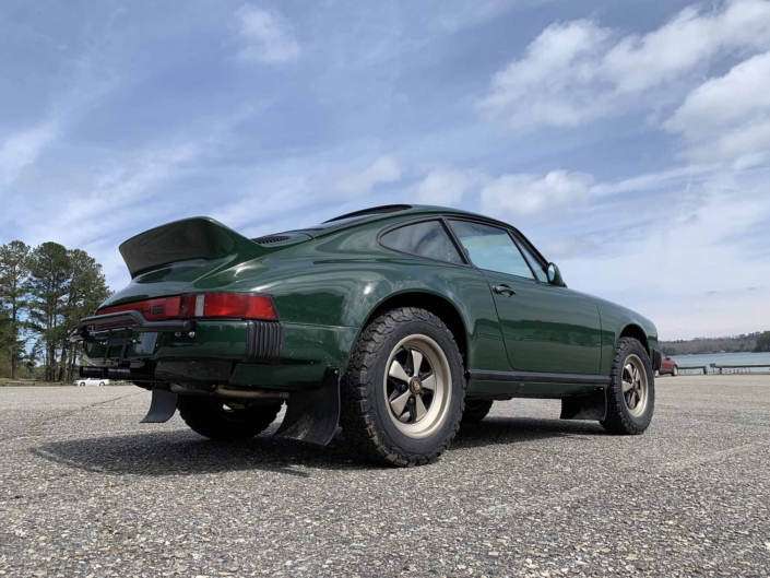 3/4 rear view of a Custom built 1982 Porsche 911 SC in Irish Green with VW tartan interior