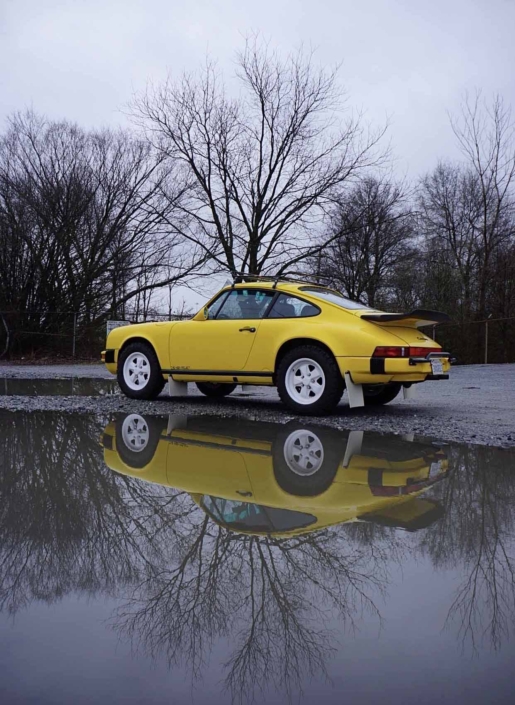 side view of a Custom Built 1988 Porsche 911 Carrera with Cadmium Yellow exterior and Opel fabric interior