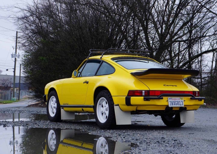 rear view of a Custom Built 1988 Porsche 911 Carrera with Cadmium Yellow exterior and Opel fabric interior