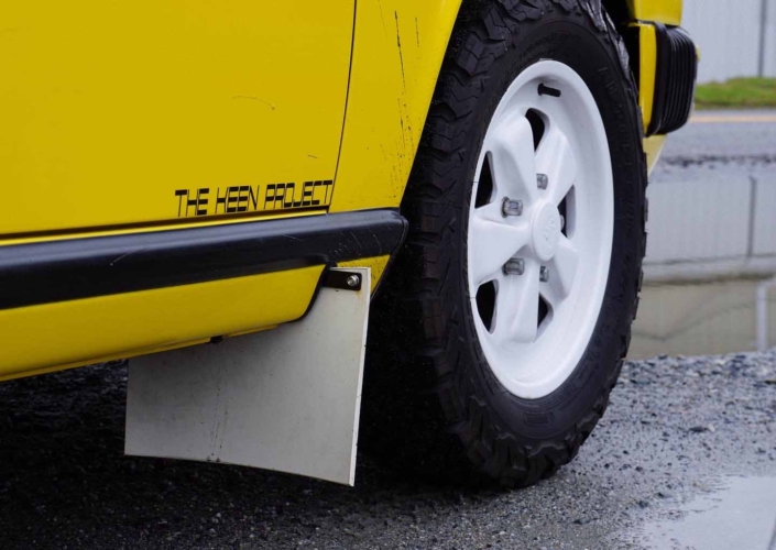 tire shot of a Custom Built 1988 Porsche 911 Carrera with Cadmium Yellow exterior and Opel fabric interior