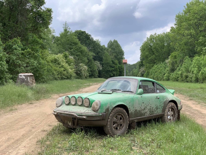 Custom Built 1981 Porsche 911 SC in Signal Green with Porsche Tartan Interior after driving through the mud