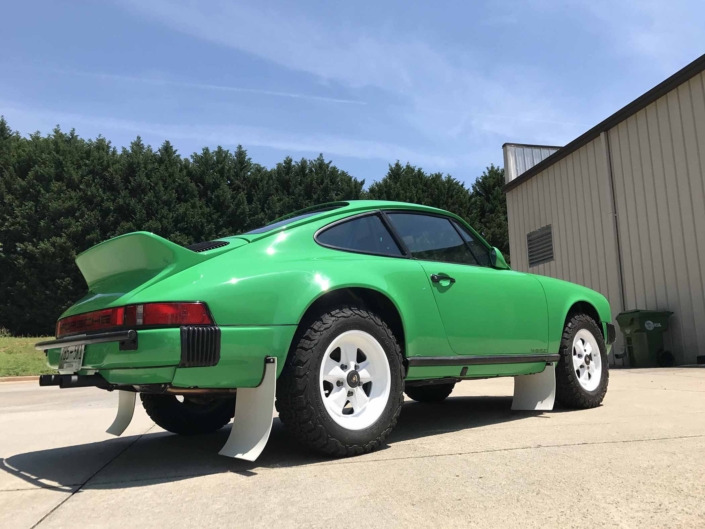 3/4 side view of Leh Keen's Custom Built 1981 Porsche 911 SC in Signal Green with Porsche Tartan Interior