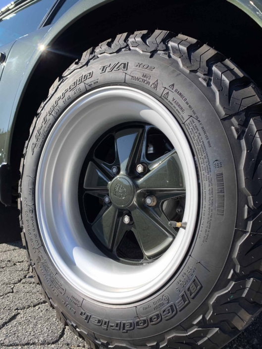 tire shot of a Custom Built 1986 Porsche 930 Turbo with Oak Green Metallic Exterior and Porsche tartan interior