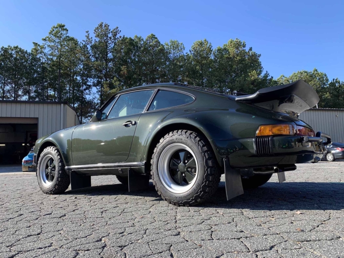 3/4 side view of a Custom Built 1986 Porsche 930 Turbo with Oak Green Metallic Exterior and Porsche tartan interior