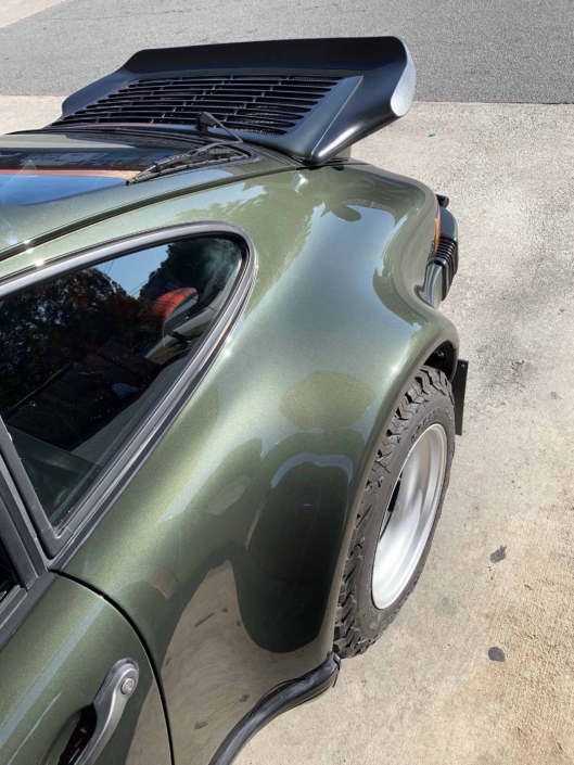 rear view window on a Custom Built 1986 Porsche 930 Turbo with Oak Green Metallic Exterior and Porsche tartan interior