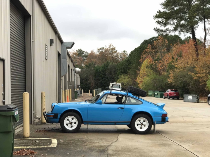 side view of Custom Built 1980 Porsche 911 SC in Riviera Blue with blue and brown basket weave interior