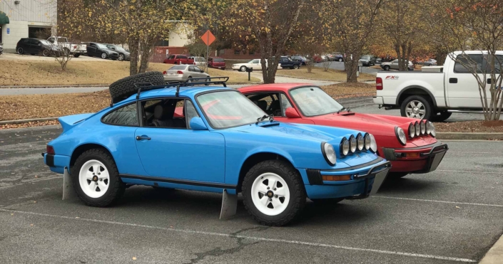 Custom Built 1980 Porsche 911 SC in Riviera Blue with blue and brown basket weave interior parked in a parking lot