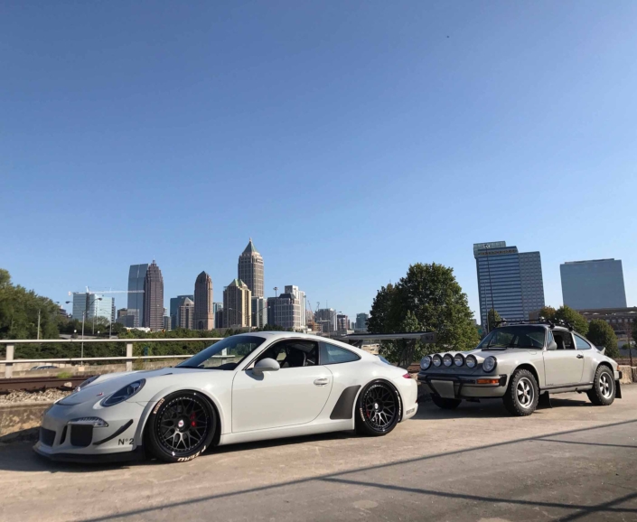 Custom Built 1986 Porsche 911 Carrera with Fashion Grey Exterior and Lancia Fabric Interior parked on a highway in the city