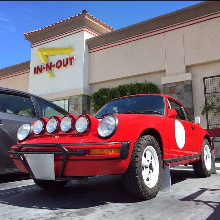 Custom Built Red Porsche parked in front of In In-N-Out Burger