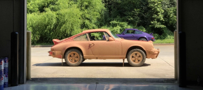 Custom Built 1981 Guards Red Porsche 911 SC covered in mud after off roading