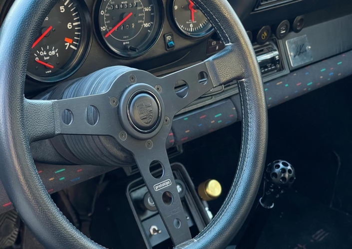 Interior view of Leh Keen's Custom Built 1983 930 Turbo in Moonstone with "Windows 95 in color" fabric