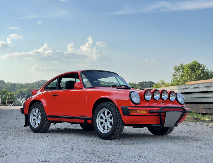 Front 3/4 View of Leh Keen's Custom 1984 911 Carrera in Blood Orange with Mercedes 300SL fabric